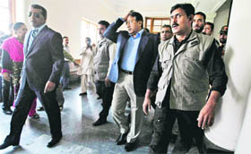 Former Pakistan President Pervez Musharraf on his way to a court room in Karachi on Friday.