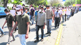 Students of NIPER take part in a silent march in support of their demands in Mohali on Sunday.