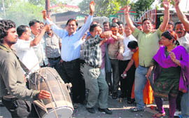 BJP workers celebrate the announcement of new office-bearers of the party in Dehradun on Sunday.