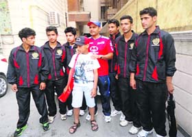 Young cricketers from the Valley with Virender Sehwag at New Delhi
