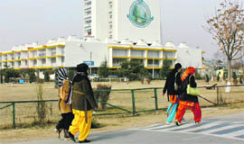 Students walk on Kashmir University campus.