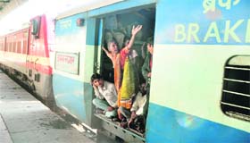 A woman passenger, who left her luggage on the platform, cries for help at the Ludhiana railway station on Sunday