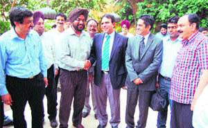 Municipal Corporation Commissioner Bhupinder Singh welcomes delegates from Pakistan on their arrival in Amritsar on Monday. 