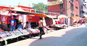 A view of widespread encroachments on the Ram Bagh road, which is a part of the inner peripheral road, in Amritsar on Monday. 