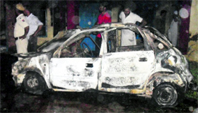 The remains of a Maruti Zen in which a cylinder blast had occurred at Kotshamir village on Sunday night.