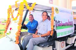 Dr PP Bhojvaid (driving the vehicle), Director, FRI, and Dr VK Bahuguna, Director General, Indian Council of Forestry Research and Education, in a battery-operated cart on the FRI campus in Dehradun on Monday.