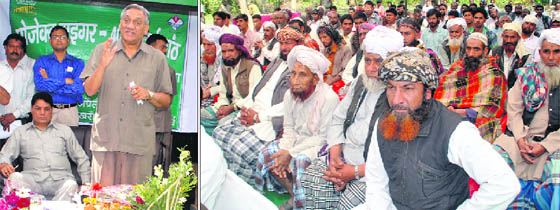 (Left) Chief Minister Vijay Bahuguna addresses a function on the occasion of the 40th anniversary of Project Tiger at Jim Corbett National Park on Monday; and Van Gujjars listen to Bahuguna with rapt attention.