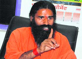 Baba Ramdev addresses mediapersons during a press conference in Ambala City recently