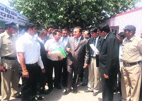 Justice Jitender Chauhan interacts with lawyers during his visit to the court at Bahadrugarh town in Jhajjar
