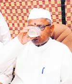 Flavour of Punjab Social activist Anna Hazare enjoys a glass of lassi at Devi Talab Mandir during Jantantar Yatra in Jalandhar on Tuesday. Photo: Sarabjit Singh