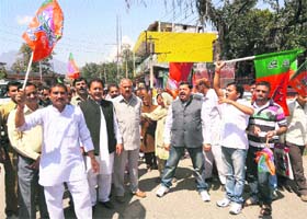 BJP activists hold a protest in Reasi on Monday