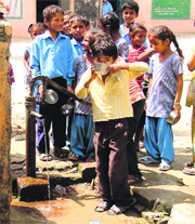 Children drinking water at a school in Ludhiana.