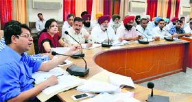 Deputy Commissioner Rahul Tiwari at a meeting with officials at Bachat Bhawan in Ludhiana on Monday.