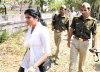 Widow of slain DSP Zia-ul-Haq at Kunda in Pratapgarh on Sunday.  PTI