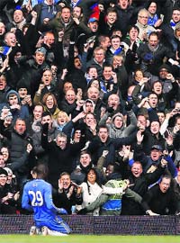 Chelsea's Demba Ba celebrates after scoring against Manchester United during their English FA Cup quarterfinal replay match in London on Monday