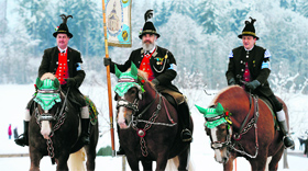 People in traditional Bavarian dresses take part in the Georgi ride on Easter Monday at Traunstein in Germany.