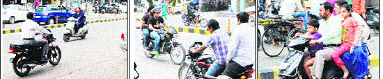People do not bother driving on the wrong side on roads in Amritsar; and (right) A family rides a scooter, ignoring traffic laws in Amritsar. 