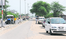 A stretch on the Bathinda-Mansa road that has not been laid for the past a year and a half is causing inconvenience to commuters. Four-wheelers meant for sale have been parked on the road by owners of the showrooms dotting the road