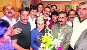 State Congress chief Sukhvinder Singh Sukhu with Irrigation and Public Health Minister Vidya Stokes at the Assembly in Shimla on Tuesday.