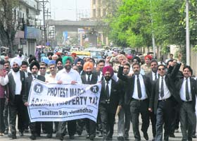 Lawyers hold a protest march on the same issue in Jalandhar on Tuesday