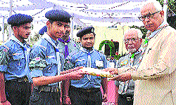 Governor NN Vohra gives away Rajya Puraskar to a Scout at Raj Bhawan in Jammu on Tuesday