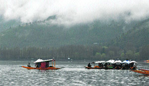 A group of tourists enjoys shikara rides on the Dal Lake in Srinagar on Tuesday.