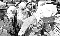 Three accused in the case pertaining to murder of BSP leader Deepak Bhardwaj being produced in a court in New Delhi on Tuesday