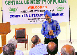 Vice-Chancellor of the Central University of Punjab addresses the participants of a computer literacy programme for senior citizens, in Bathinda on Wednesday