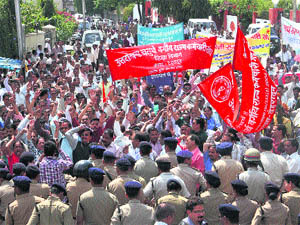 Class IV employees of the state government take out a march to the Secretariat in support of their demands in Dehradun on Wednesday. 