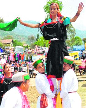 Folk artistes perform nati at a fair at Jogindernagar in Mandi on Wednesday