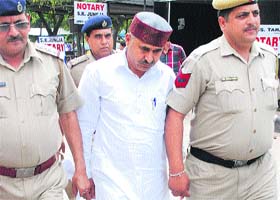 Doon MLA Ram Kumar Chaudhary being produced in court in Panchkula on Wednesday