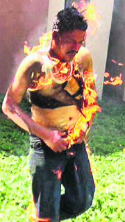 A man immolates himself in Rajkot on Wednesday.
