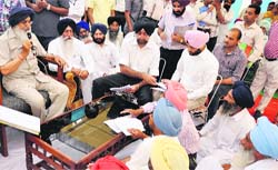 Chief Minister Parkash Singh Badal during his Sangat Darshan at Nidhanwala village in Moga on Wednesday. A Tribune photograph