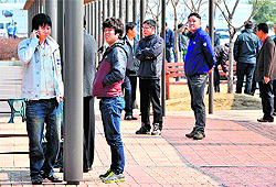 South Korean workers outside the inter-Korean transit office after being refused access to Kaesong joint industrial zone on Wednesday
