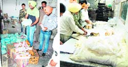 Officials inspect the noodle factory; and (right) a team at the bakery kitchen in Amritsar on Thursday. 