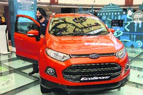 Joginder Singh, president and managing director, Ford India, poses with Ford Ecosport in Chandigarh on Thursday