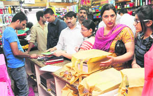 Parents purchase books at a shop in Chandigarh.