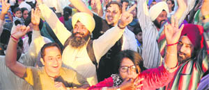 Teachers celebrate after the Education Department postponed its decision to increase their working hours, at Sector 17 in Chandigarh on Thursday. 