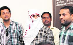 The accused in police custody in Dehradun on Thursday. Tribune photo: Vinod Pundir
