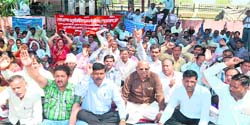 Class IV employees of the state government stage a protest as part of their indefinite strike in Haridwar on Thursday. Tribune photo: Rameshwar Gaur