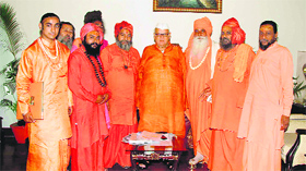 A delegation of saints from the Juna (Bhairav) Akhara, Haridwar, meets Governor Aziz Qureshi in Dehradun on Thursday.