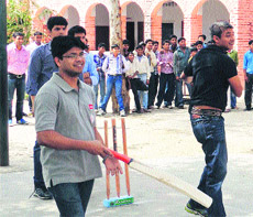 Cricketer Ajay Jadeja bowls during a match at a school in Sonepat recently.