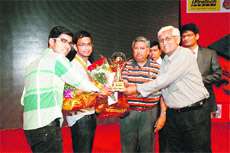 The winning team of the National Institute of Technology (NIT), Kurukshetra, receives the winners trophy of the North India Concrete Quiz in Panchkula. 