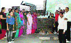 Residents with SDM Ajit Bhardwaj and MC chief Suman Verma at the 1905 earthquake memorial in Kangra on Thursday