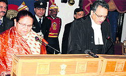 Governor Urmila Singh administers the oath of office and secrecy to Justice Ajay Manikrao Khanwilkar as the Chief Justice of the HP High Court at Raj Bhawan in Shimla on Thursday