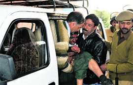 An injured student being taken to a local hospital in Anantnag on Thursday.