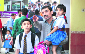 After a crackdown by the traffic police on school vehicles, parents pick their children from St Josephs school in Jalandhar on Thursday.