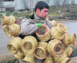 A vendor sells kangris in Pulwama on Thursday. 