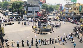 SFI and DYFI activists form a human chain during a protest over the death of SFI leader Sudipta Gupta in Kolkata on Thursday