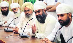 International Namdhari Sangat president Navtej Singh (second from right) addresses mediapersons in Ludhiana on Thursday. Photo: Inderjeet Verma
